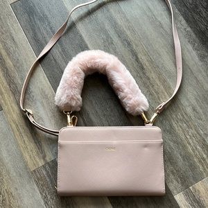 Pink calpak wallet on strap